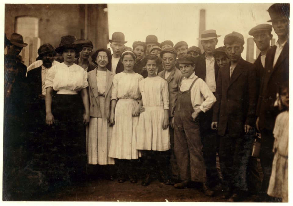 Group of workers, including boys and girls, standing outdoors LOC nclc.01302
