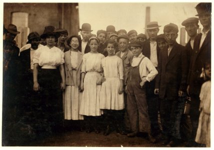 Group of workers, including boys and girls, standing outdoors LOC nclc.01302