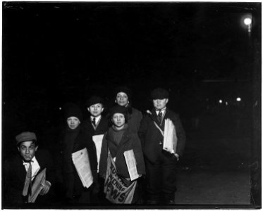Group on Court St. selling around the Shea Theatre, 8 P.M. Boy in center, Vito Bucheto, 10 years old. Behind him to... - NARA - 523275