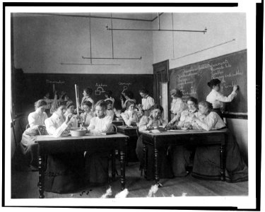 Group of young women performing atmospheric pressure experiments while studying science in normal school, Washington, D.C. LCCN90711152