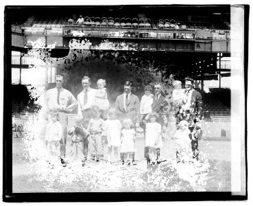Group portrait of men and children in stadium LOC npcc.04398