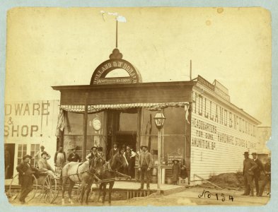 Group posed in front of the Holland & McDonald hardware store, Broken Bow, Nebraska LCCN2005693383