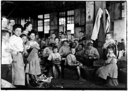 Group showing a few of the workers stringing beans in the J.S. Farrand Packing Co. Those too small to work are held... - NARA - 523215