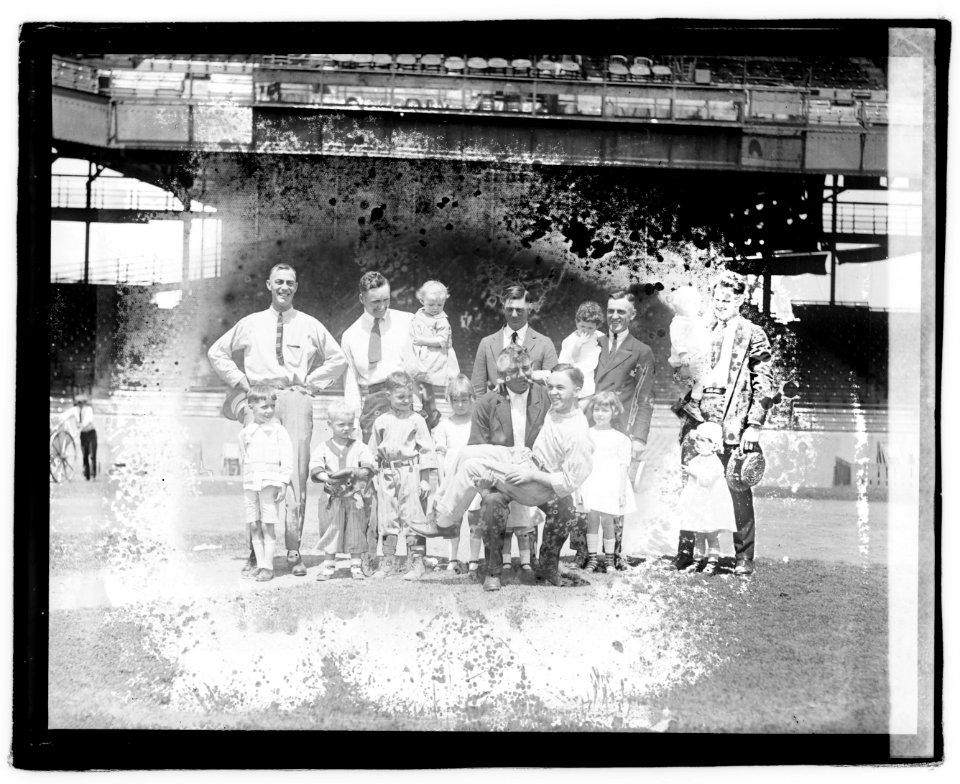 Group portrait of men and children in stadium LOC npcc.04395