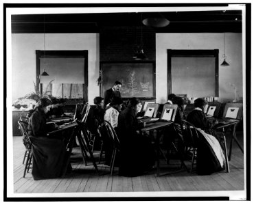 Group portrait of teacher and students at Hampton Institute painting watercolor pictures of butterflies LCCN2001695467