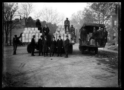 Group with boxes on trucks LCCN2016886966