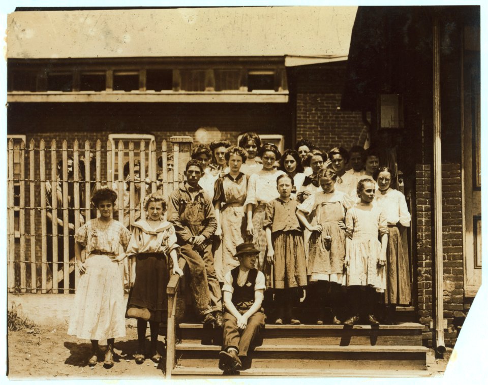 Groups of girl workers at the gate of the American Tobacco Co., Wilmington, Delaware, noon period, May 24, 1910. Young girls obviously under 14 years of age, who work about 10 hours a day LOC nclc.04670