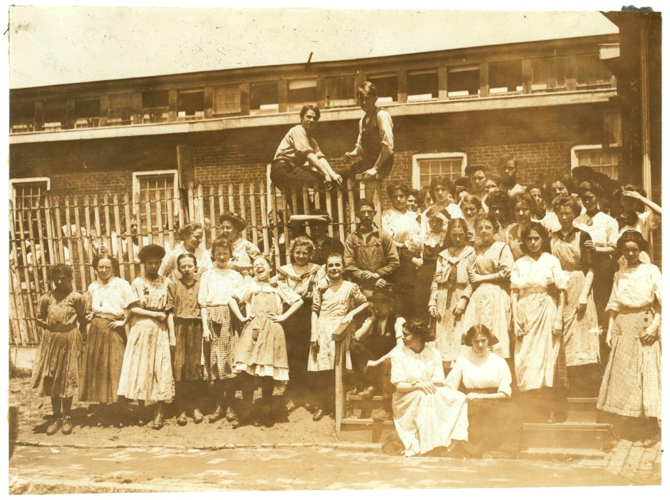 Groups of girls workers at the gate of the American Tobacco Co., Wilmington, Delaware, noon period, May 24, 1910. Young girls obviously under 14 years of age, who work about 10 hours a day LOC nclc.04671