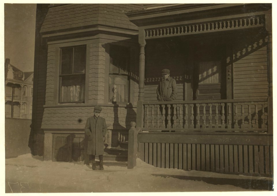 Fred Arnold, standing at foot of steps at home of step-father with whom he lives. LOC cph.3b32765
