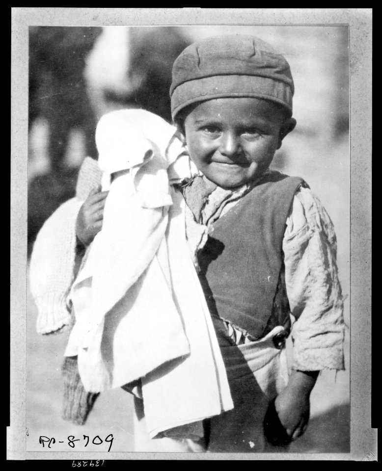 Fresh clean clothing - is welcomed by this youngster jud(g)ing by his expression He is one of the young members of the camp of Greeks from the Caucasus brought back to colonize the rewon LCCN2010648490