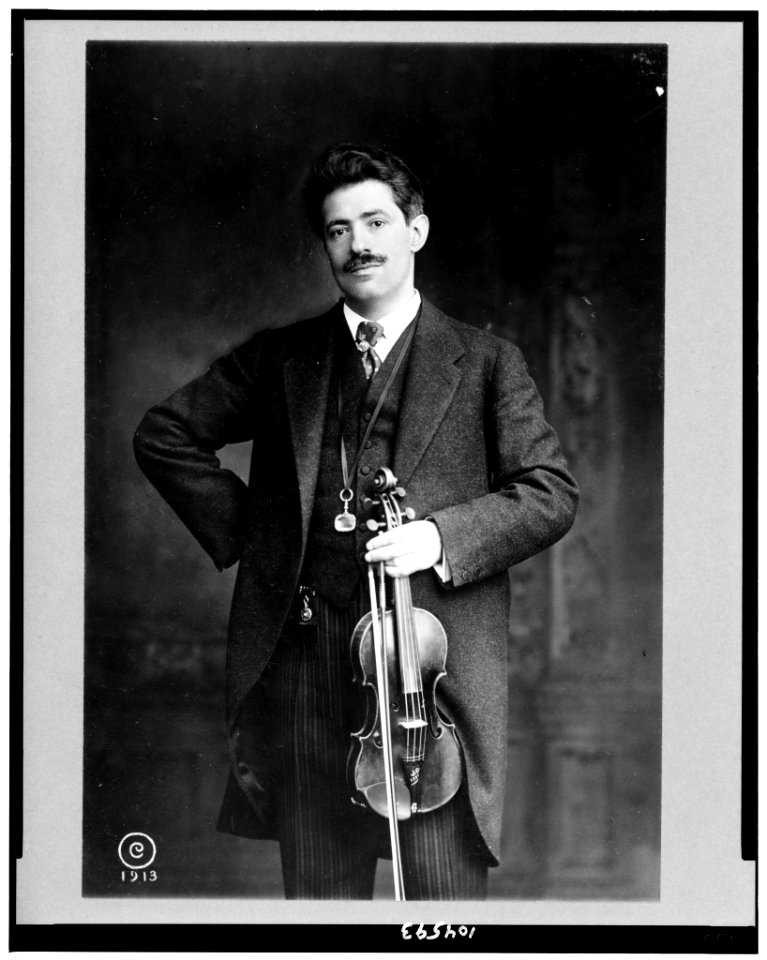 Fritz Kreisler, three-quarter length portrait, standing, facing slightly left, holding violin and bow LCCN91794749