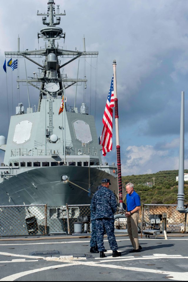 From left, U.S. Navy Cmdr. Dave Stoner, the commanding officer of the guided missile destroyer USS Ramage (DDG 61), and Command Master Chief Joseph O'Brien, the Ramage's command master chief, speak with 131115-N-VC236-015