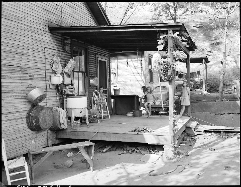 Front porch of home of Virgil Price, miner. They have lived here 12 years. Have 4 children, 2 beds, pay rent $10 per... - NARA - 541270