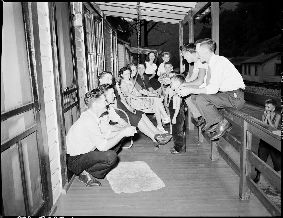 Front porch of the Harry Fain home on Sunday afternoon. Relatives and other company are frequent Sunday visitors.... - NARA - 541435