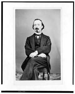Full-length portrait of a man, seated, facing front LCCN2005692478