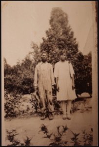 Full length portrait of an unidentified man and woman, standing side by side on dirt road LCCN2015650128 photo