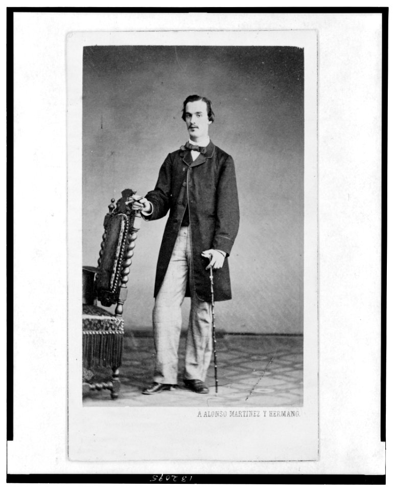 Full-length portrait of a man, standing, facing front, holding a cane LCCN2005692482