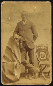 Full-length portrait of an African American man standing among some props, facing front) - Richmond Photograph Co., 827 1-2 Broad St., Richmond, Va LCCN2010647840