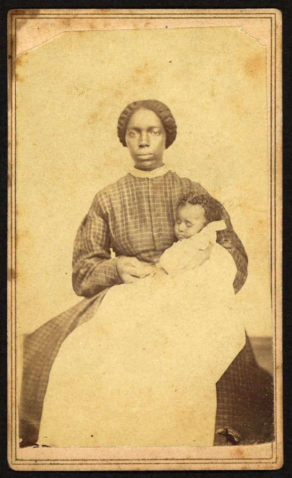 Full-length portrait of an African American woman seated holding an African American infant) - A. D. Jaynes, Photographer, Corning, N. Y LCCN2010647820
