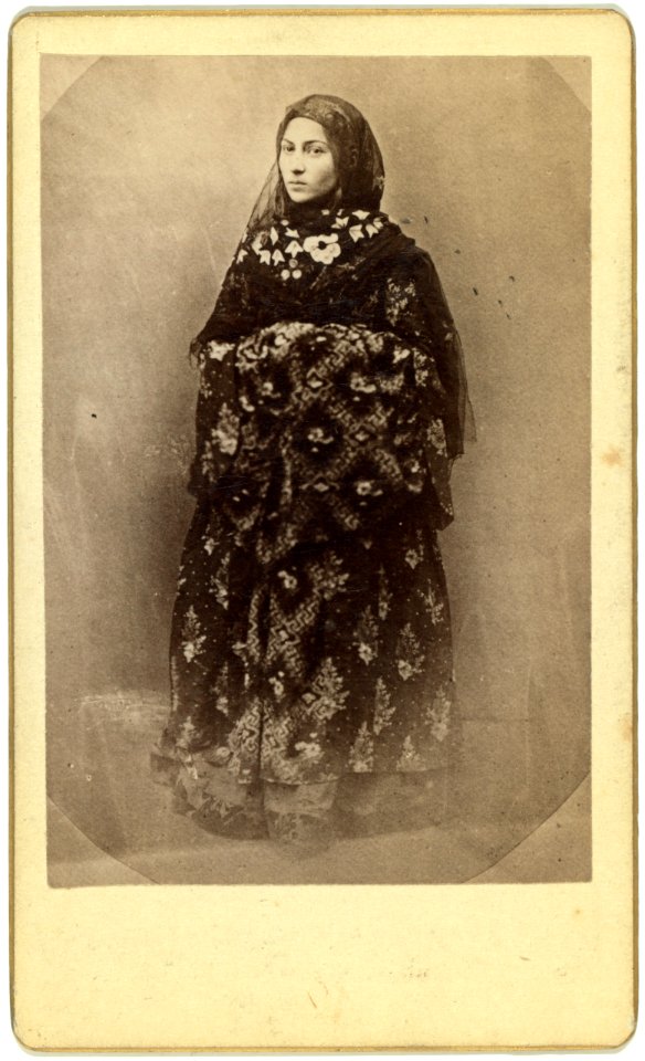 Full-length portrait of a woman in traditional dress, facing slightly left LCCN99615601