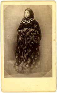 Full-length portrait of a woman in traditional dress, facing slightly left LCCN99615601
