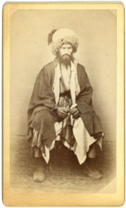 Full-length portrait of man, seated, facing front LCCN99615640