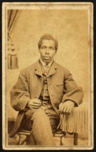 Full-length portrait of unidentified African American man seated) - T. J. Trapp, Photographer, Williamsport, Pa LCCN2010647814 photo