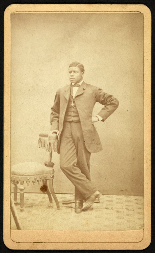 Full-length portrait of an African American man standing by a chair, facing left) - C. L. Marston, Photographer, Room no. 3, Bowman's Block, Bangor, Maine LCCN2010647838