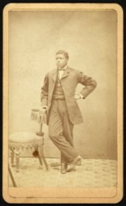 Full-length portrait of an African American man standing by a chair, facing left) - C. L. Marston, Photographer, Room no. 3, Bowman's Block, Bangor, Maine LCCN2010647838