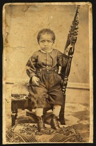 Full-length portrait of an African American toddler seated on a chair) - M. L. Albright, Photographist, Urbana, Ohio LCCN2010647804