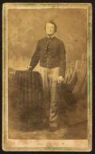 Full-length portrait of unidentified civil war soldier standing next to a table) - J.P. Ball's Photographic Gallery, No. 30 West 4th St., between Main and Walnut Streets, Cincinnati, O LCCN2010647783