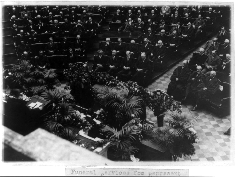 Funeral services for Representative James R. Mann, of Ill., in the House of Representatives - Pres. Harding seated in the center seat in the front row on the Republican side of the House, LCCN2002695665