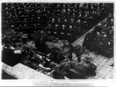 Funeral services for Representative James R. Mann, of Ill., in the House of Representatives - Pres. Harding seated in the center seat in the front row on the Republican side of the House, LCCN2002695665