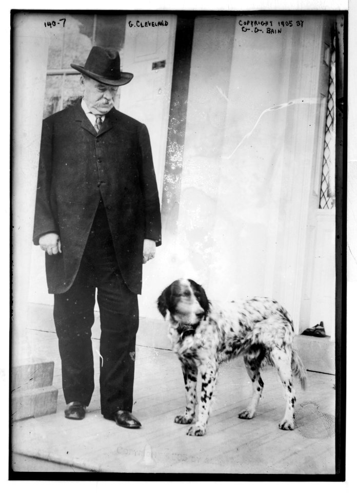 G. Cleveland, standing with dog LCCN2014680825