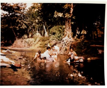 Guam women washing laundry in stream, June 1945