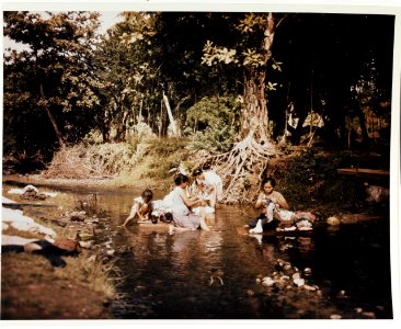 Guam women washing laundry in stream, June 1945