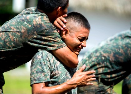 Guatemalan marines participate in a combat conditioning exchange with U.S. Marines assigned to a landing attack subsequent operations team as part of U.S. Marine Corps Martial Arts Program training during 140819-N-XQ474-094