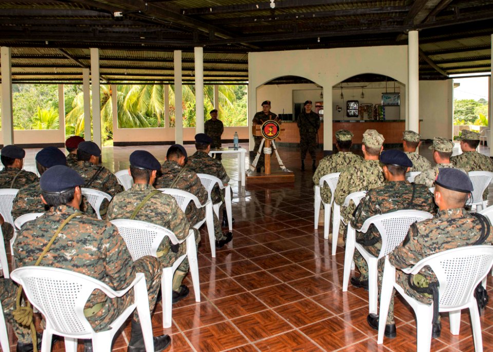 Guatemalan Naval Infantry Force Capitan de Navio Saul Arnoldo Tobar Garcia, at lectern, speaks to U.S. Sailors attached to Coastal Riverine Squadron (CORIVRON) 2 and Guatemalan service members as part of their 140821-N-QY430-022