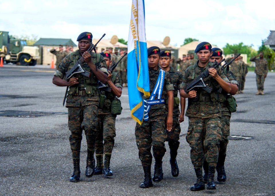 Guatemalan service members participate in a closing ceremony at the Guatemalan Marine Brigade base in Puerto Barrios, Guatemala, Aug. 22, 2014, as part of Southern Partnership Station (SPS) 2014 140822-N-XQ474-164