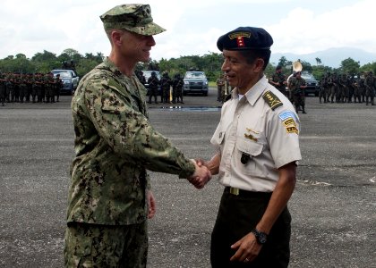 Guatemala marine corps Commandant Col. Medardo Monterroso Suarez, right, greets U.S. Navy Cmdr. Jeffrey V. Morganthaler during Southern Partnership Station (SPS) 2014 in Puerto Barrios, Guatemala, Aug. 8, 2014 140808-N-QY430-013