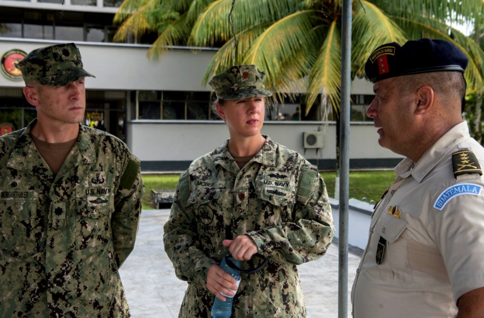 Guatemala marine corps Col. Jose Ricardo Sosa Mirón, right, an administration officer, speaks to U.S. Navy Cmdr. Jeffrey V. Morganthaler, left, the Southern Partnership Station (SPS) 2014 commanding officer ashor 140808-N-QY430-003