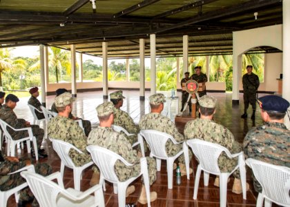 Guatemalan Naval Infantry Force Capitan de Navio Saul Arnoldo Tobar Garcia, at lectern, speaks to U.S. Sailors attached to Coastal Riverine Squadron (CORIVRON) 2 and Guatemalan service members as part of their 140821-N-QY430-004