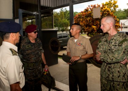 Guatemalan Naval Infantry Force Coronel Medardo Monterroso Suarez speaks with Coronel de Infanteria Ronal Herman Velasquez Sosa, U.S. Navy Cmdr. Jeffrey V. Morganthaler, right, the commanding officer ashore 140808-N-QY430-001