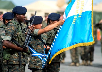 Guatemalan service members participate in a closing ceremony at the Guatemalan Marine Brigade base in Puerto Barrios, Guatemala, Aug. 22, 2014, as part of Southern Partnership Station (SPS) 2014 140822-N-XQ474-086
