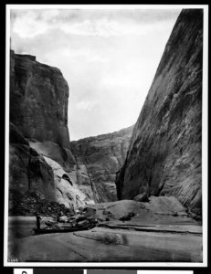 Guiding a small boat through the narrows of the Colorado River at Lee's Ferry in Marble Canyon, Grand Canyon, 1900-1930 (CHS-3898) photo