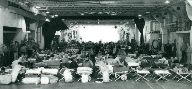 Hangar bay of USS Lunga Point (CVE-94) with beds, circa in July 1944