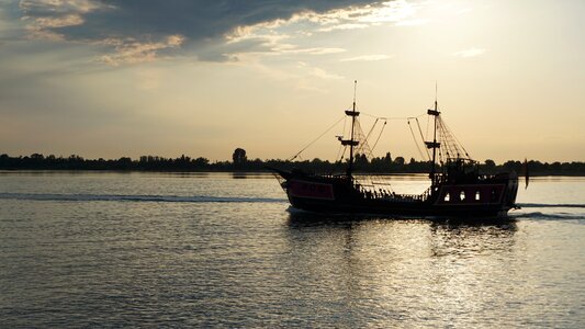 Water evening sun sailing vessel photo