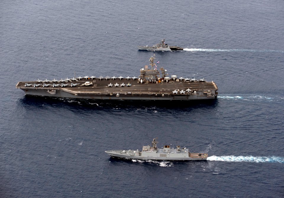 INS Kulish (P63), top, and INS Satpura (F48), bottom, and USS Carl Vinson (CVN 70) are underway in formation during Exercise Malabar 2012