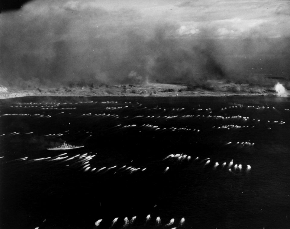 Initial waves of amphibious tractors head for the landing beaches on Iwo Jima, 19 February 1945 (80-G-310951)