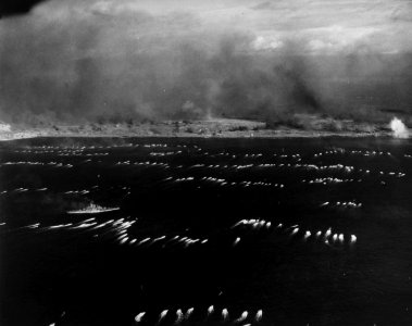Initial waves of amphibious tractors head for the landing beaches on Iwo Jima, 19 February 1945 (80-G-310951)
